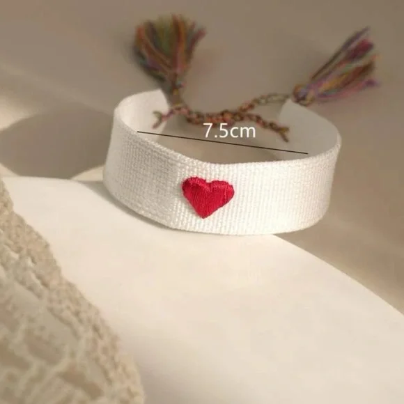White Woven Embroidered Tassel Bracelet with Red Heart Accent - Picture 3 of 8